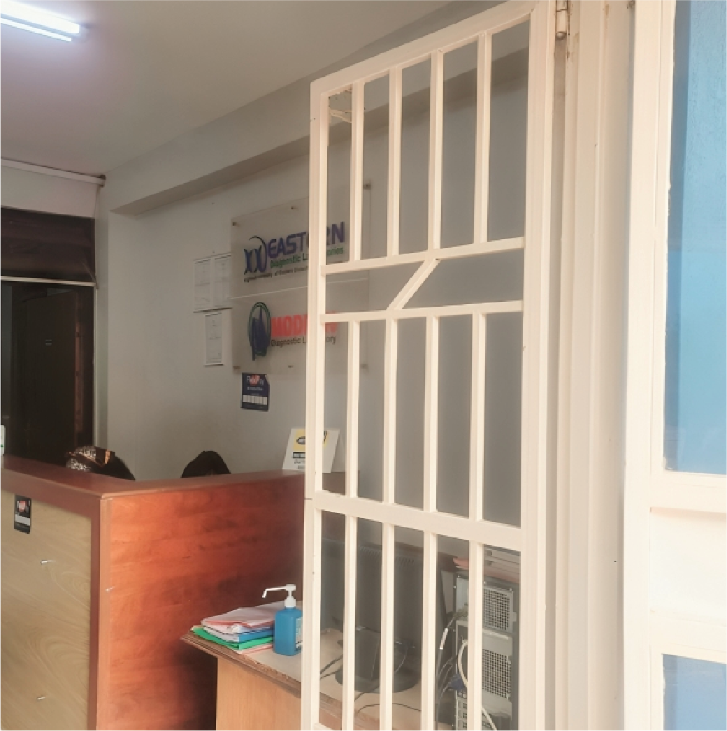 Lab technician examining blood test tubes